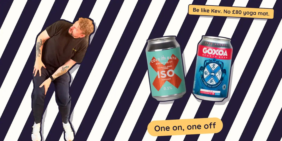 Kev glancing back beside Cold Bath ISO and Goxoa alcohol free beers on black and white zebra stripes