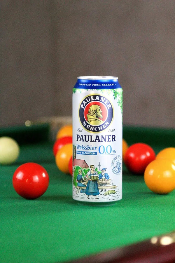 Paulaner Weissbier 0.0% alcohol free wheat beer can on a pool table among the balls